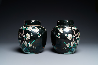 A pair of Chinese famille noire jars and covers, 19th C.