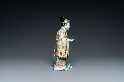 A Chinese famille verte figure on wooden stand, Kangxi