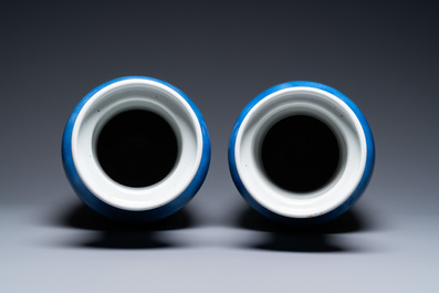 A pair of Chinese famille verte powder-blue ground vases, Kangxi mark, 19th C.