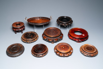 A varied collection of Chinese wooden stands and a silver-mounted tray, 19/20th C.