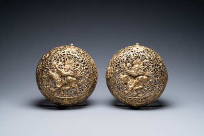 A pair of reticulated Tibetan copper incense balls, 17/18th C.