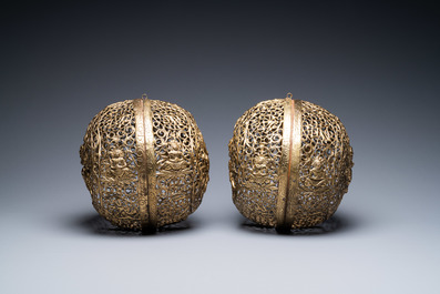 A pair of reticulated Tibetan copper incense balls, 17/18th C.