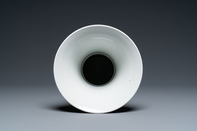Un vase de forme 'gu' en porcelaine de Chine en rouge de fer et dor&eacute;, Kangxi