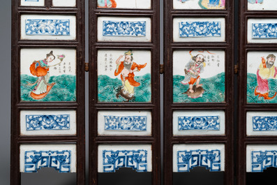 A Chinese five-fold wooden screen with famille rose plaques, 19th C.