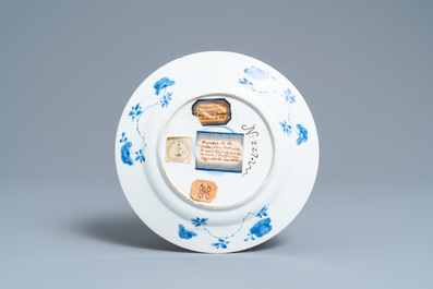 A Chinese blue and white plate with a boy surrounded by antiquities, ex-coll. August the Strong, Kangxi