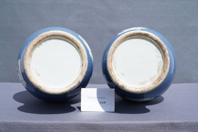 A pair of Chinese white slip-decorated blue-ground vases, 19th C.