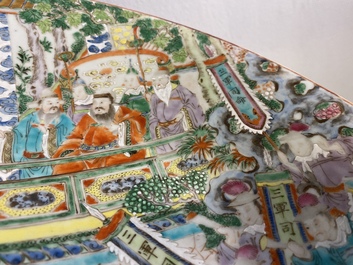 A large Chinese Canton famille rose 'horseriders' dish, 19th C.