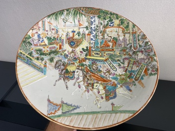A large Chinese Canton famille rose 'horseriders' dish, 19th C.