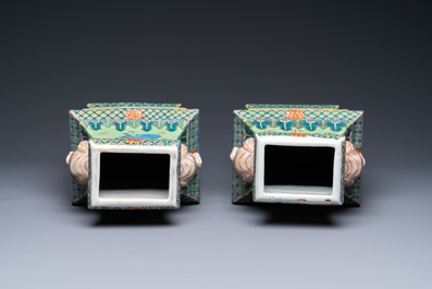 A pair of Chinese famille rose elephant head-handled vases, 19th C.