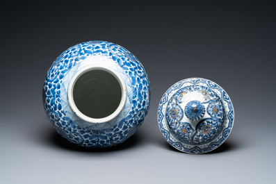 A Chinese gilt-heightened blue and white vase and cover, Kangxi/Yongzheng