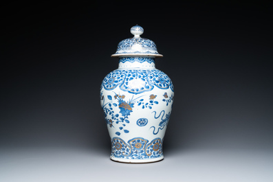 A Chinese gilt-heightened blue and white vase and cover, Kangxi/Yongzheng