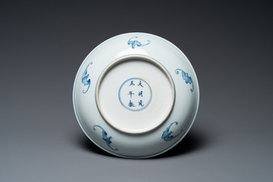 A Chinese verte biscuit figure, a green 'lotus' jar and a figurative blue and white plate, Kangxi and later
