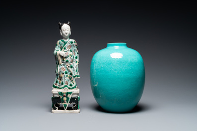 A Chinese verte biscuit figure, a green 'lotus' jar and a figurative blue and white plate, Kangxi and later