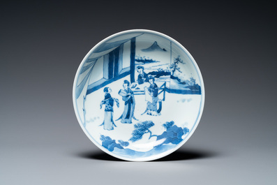 A Chinese verte biscuit figure, a green 'lotus' jar and a figurative blue and white plate, Kangxi and later