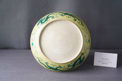 A Chinese yellow-ground famille verte 'dragon' dish, probably Qianlong