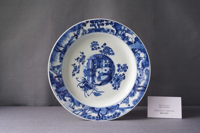 A Chinese blue and white dish with raised central medallion, Kangxi