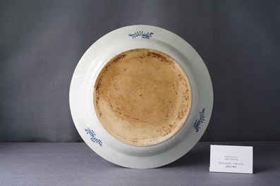 A large deep Chinese blue and white dish with a lady, Qianlong