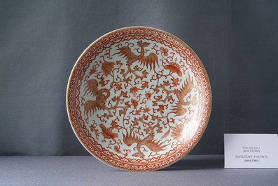 A Chinese iron-red and gilt 'phoenixes' dish, 19th C.