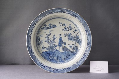 A large deep Chinese blue and white dish with a lady, Qianlong
