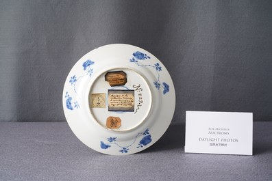A Chinese blue and white plate with a boy surrounded by antiquities, ex-coll. August the Strong, Kangxi