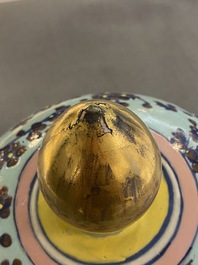 A very large Chinese famille rose turquoise-ground vase and cover, 19th C.