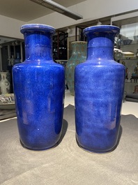 A pair of Chinese monochrome powder blue rouleau vases, Kangxi