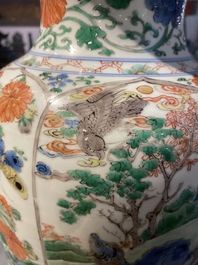 A pair of Chinese famille verte 'mythical animals' vases, Kangxi
