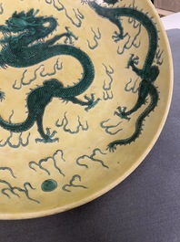 A Chinese yellow-ground famille verte 'dragon' dish, probably Qianlong