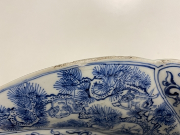 A Chinese blue and white gadrooned dish with phoenixes and monkeys, Kangxi