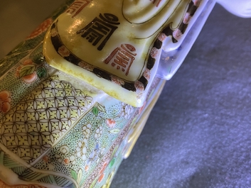 A Chinese famille verte figure on wooden stand, Kangxi