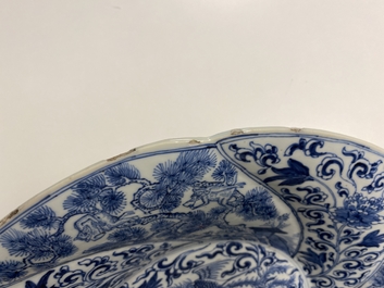 A Chinese blue and white gadrooned dish with phoenixes and monkeys, Kangxi