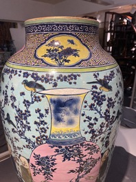 A very large Chinese famille rose turquoise-ground vase and cover, 19th C.