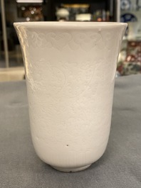 A Chinese white-glazed anhua-decorated 'peony' cup, Xuande mark, Kangxi