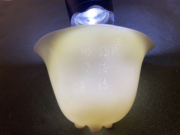 A Chinese Dehua blanc de Chine tripod wine cup with inscription, Kangxi