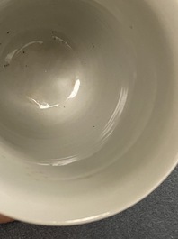 A Chinese white-glazed anhua-decorated 'peony' cup, Xuande mark, Kangxi