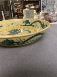 A Chinese yellow-ground famille verte 'dragon' dish, probably Qianlong
