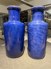 A pair of Chinese monochrome powder blue rouleau vases, Kangxi