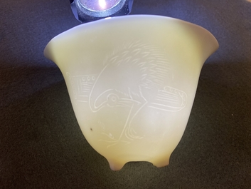 A Chinese Dehua blanc de Chine tripod wine cup with inscription, Kangxi