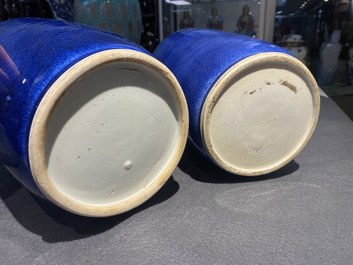 A pair of Chinese monochrome powder blue rouleau vases, Kangxi