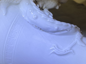 A Chinese Dehua blanc de Chine vase with applied dragon, Kangxi/Yongzheng