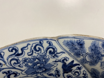 A Chinese blue and white gadrooned dish with phoenixes and monkeys, Kangxi