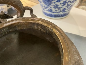 A large Chinese dragon-handled bronze tripod censer and cover, Xuande mark, 18/19th C.