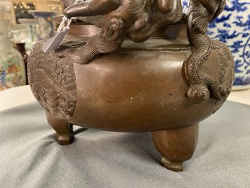 A large Chinese dragon-handled bronze tripod censer and cover, Xuande mark, 18/19th C.
