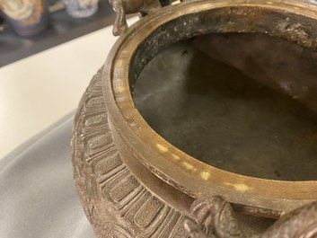 A large Chinese dragon-handled bronze tripod censer and cover, Xuande mark, 18/19th C.