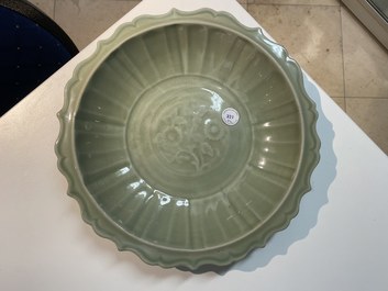 Two Chinese Longquan celadon dishes with underglaze design, Ming