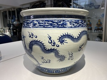 A Chinese blue and white 'dragons' fish bowl, Qianlong/Jiaqing