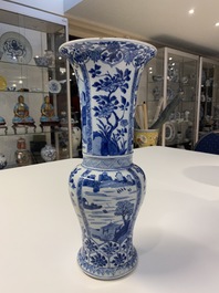 Een Chinese blauw-witte 'yenyen' vaas met landschappen en florale panelen, Kangxi