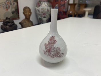 A small Chinese copper-red bottle vase with Buddhist lions, Kangxi