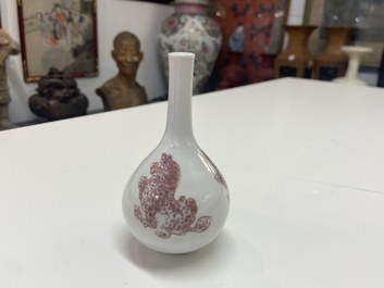 A small Chinese copper-red bottle vase with Buddhist lions, Kangxi