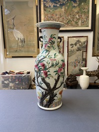 A Chinese famille rose molded 'nine peaches' vase, 19th C.
